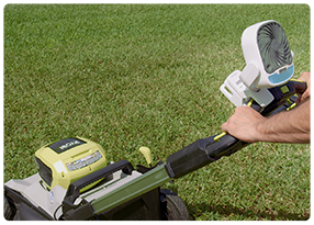 Arctic Air® Grip Go™ attached to a lawnmower to stay cool