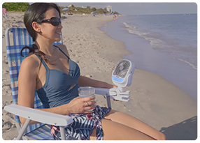 Woman staying cool at the beach with Arctic Air® Grip Go™